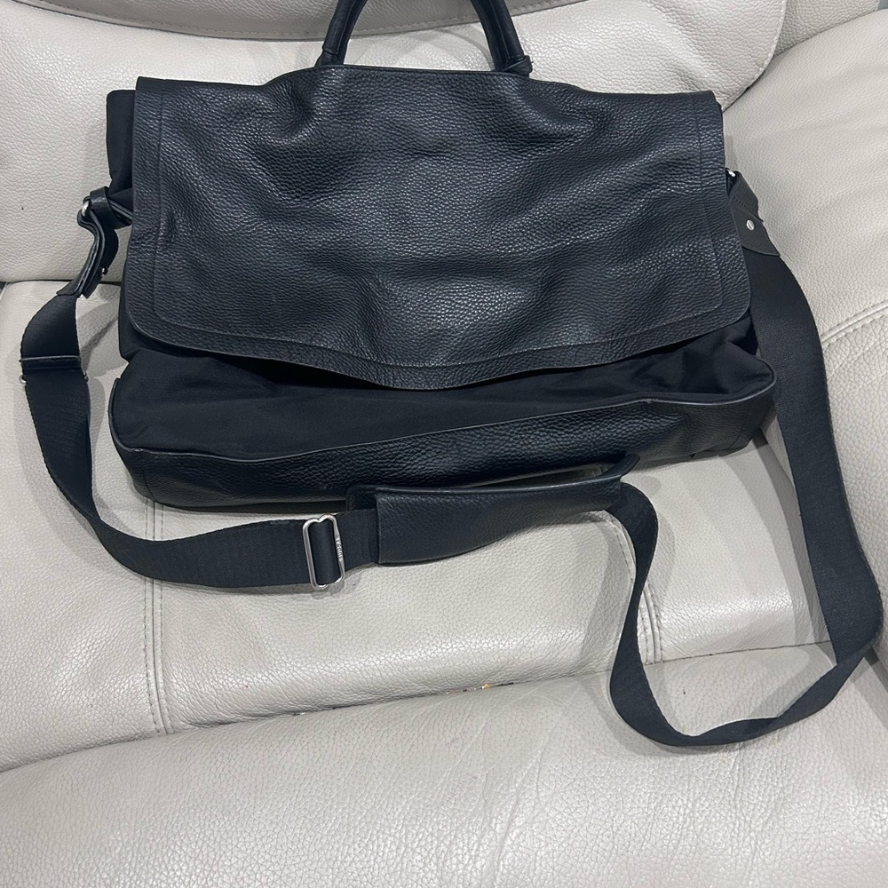 RUDSAK Black Messenger Bag with Fold-Over Flap and Textured Finish